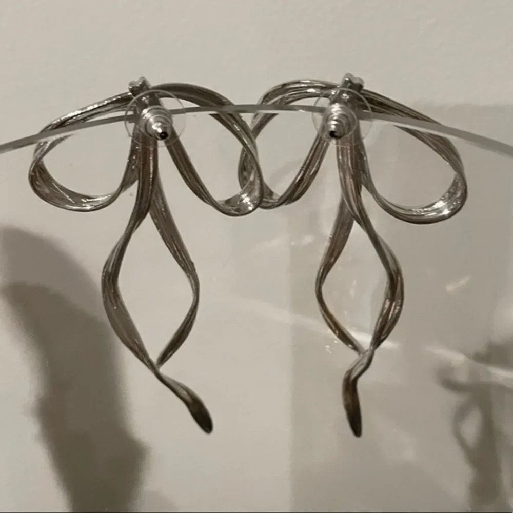 Anthro Silver Bow Earring